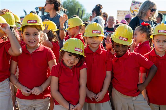  Galveston Elementary School students with plastic construction hats